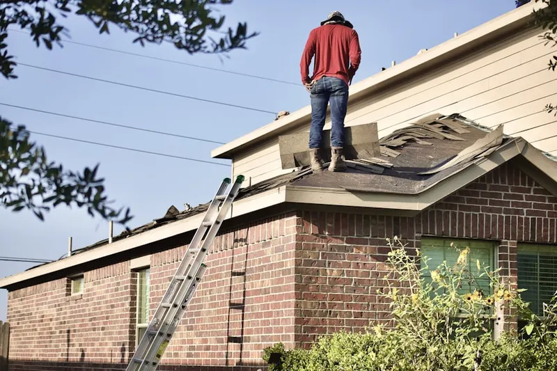 Professional roofer working on a residential roof in Etiwanda